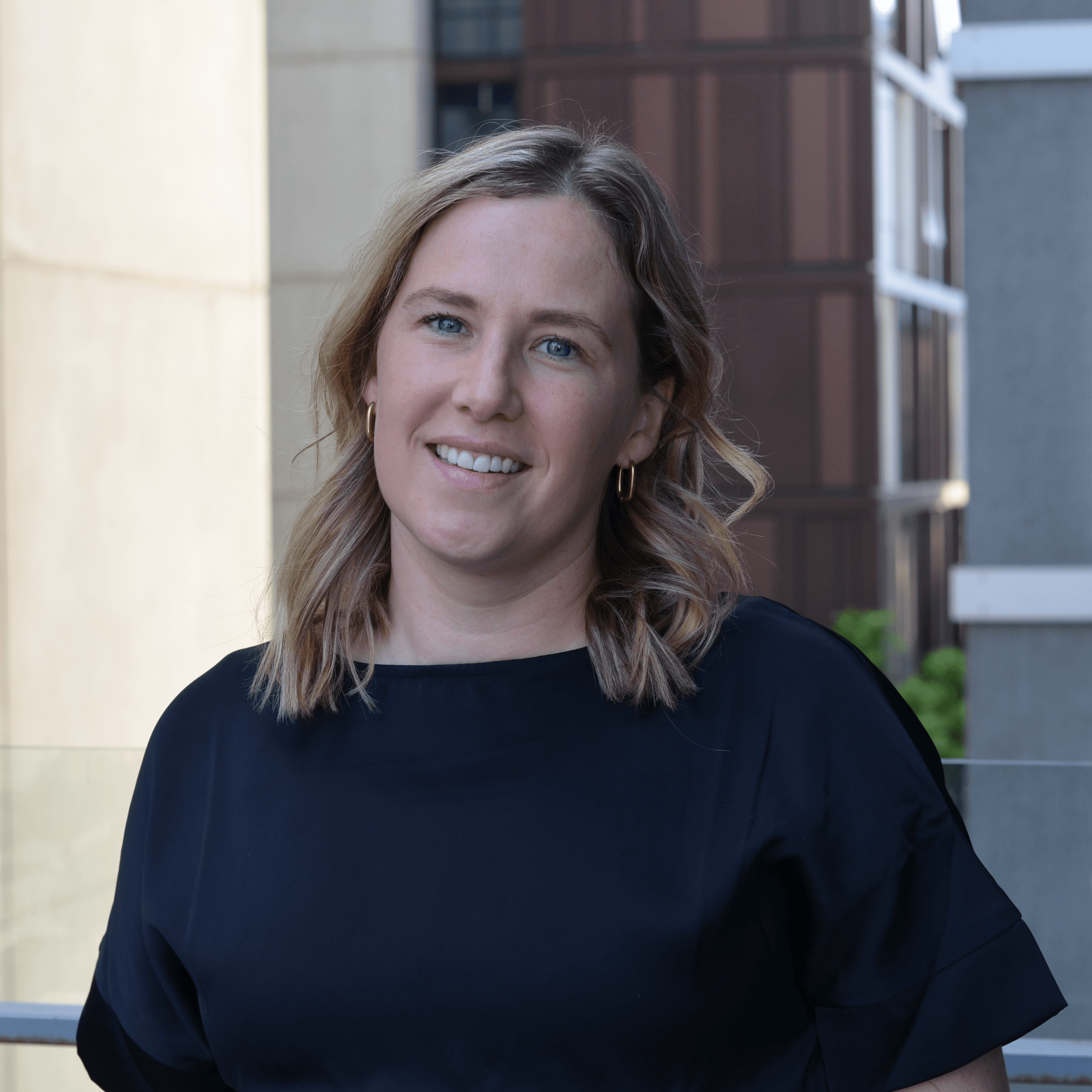Emma Ross, Curriculum Writer Emma Ross in black top outside the Faculty of Education
