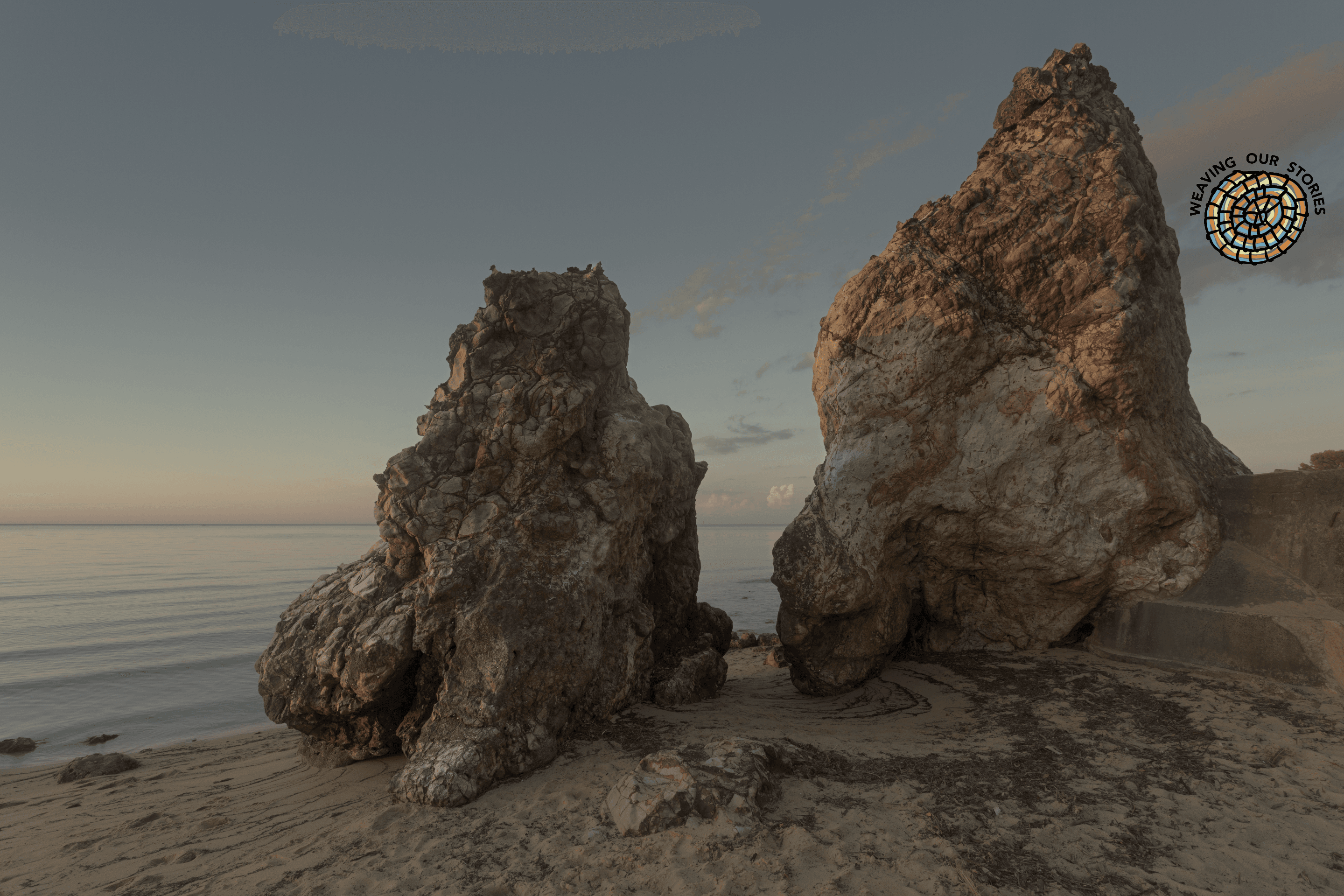 Daveys Bay Beach - Frankston South. Photographer: Nina Pearman. Source: Getty Images. Used under Licence. Two large rock formations at Daveys beach in Frankston South, with WoS Logo top right hand corner