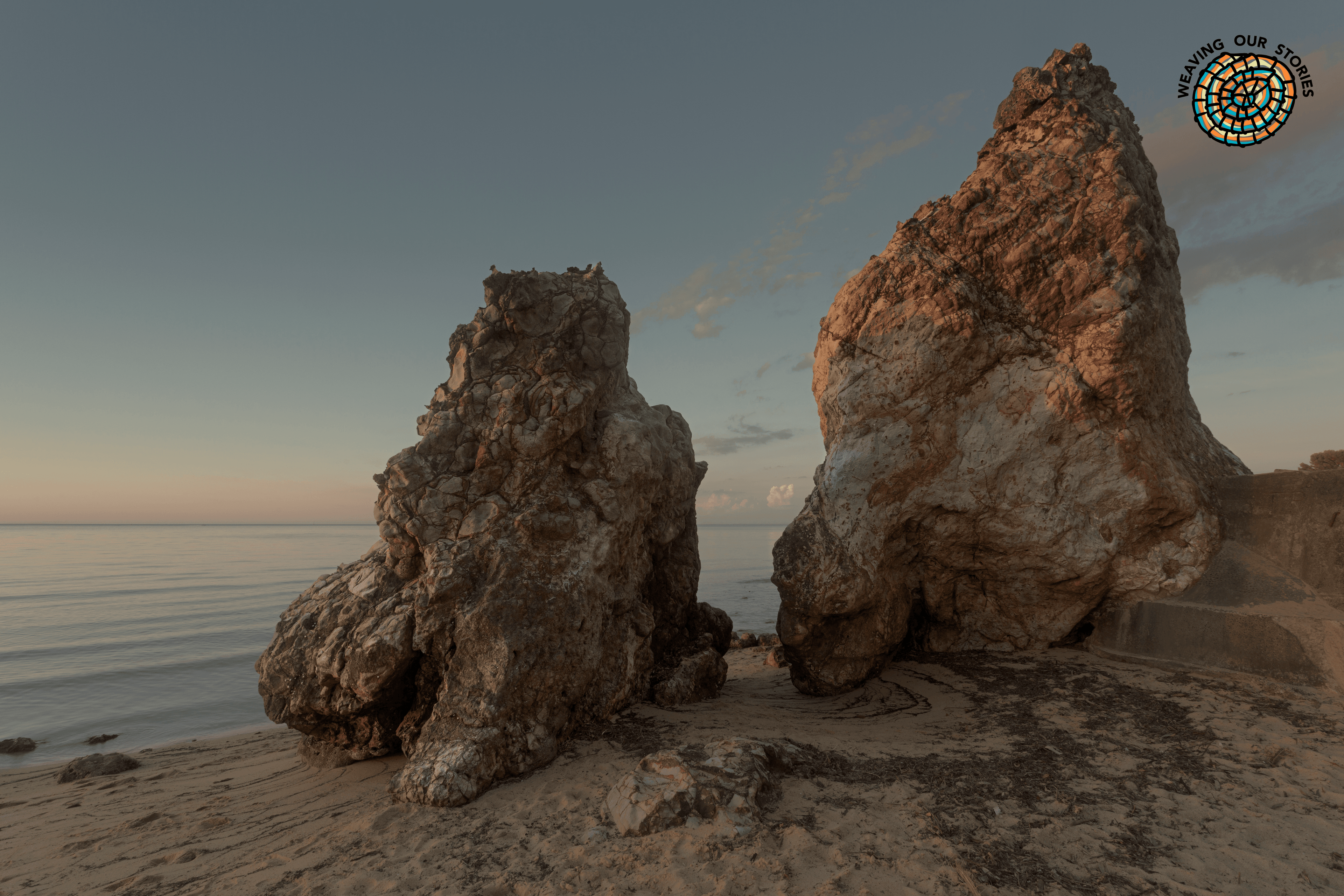 Daveys Bay Beach - Frankston South. Photographer: Nina Pearman. Source: Getty Images. Used under Licence. Two large rock formations at Daveys beach in Frankston South, with WoS Logo top right hand corner
