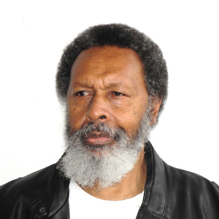 Dr John Doolah, Postdoctoral Fellow Dr John Doolah in white shirt and black leather jacket in front of white backdrop