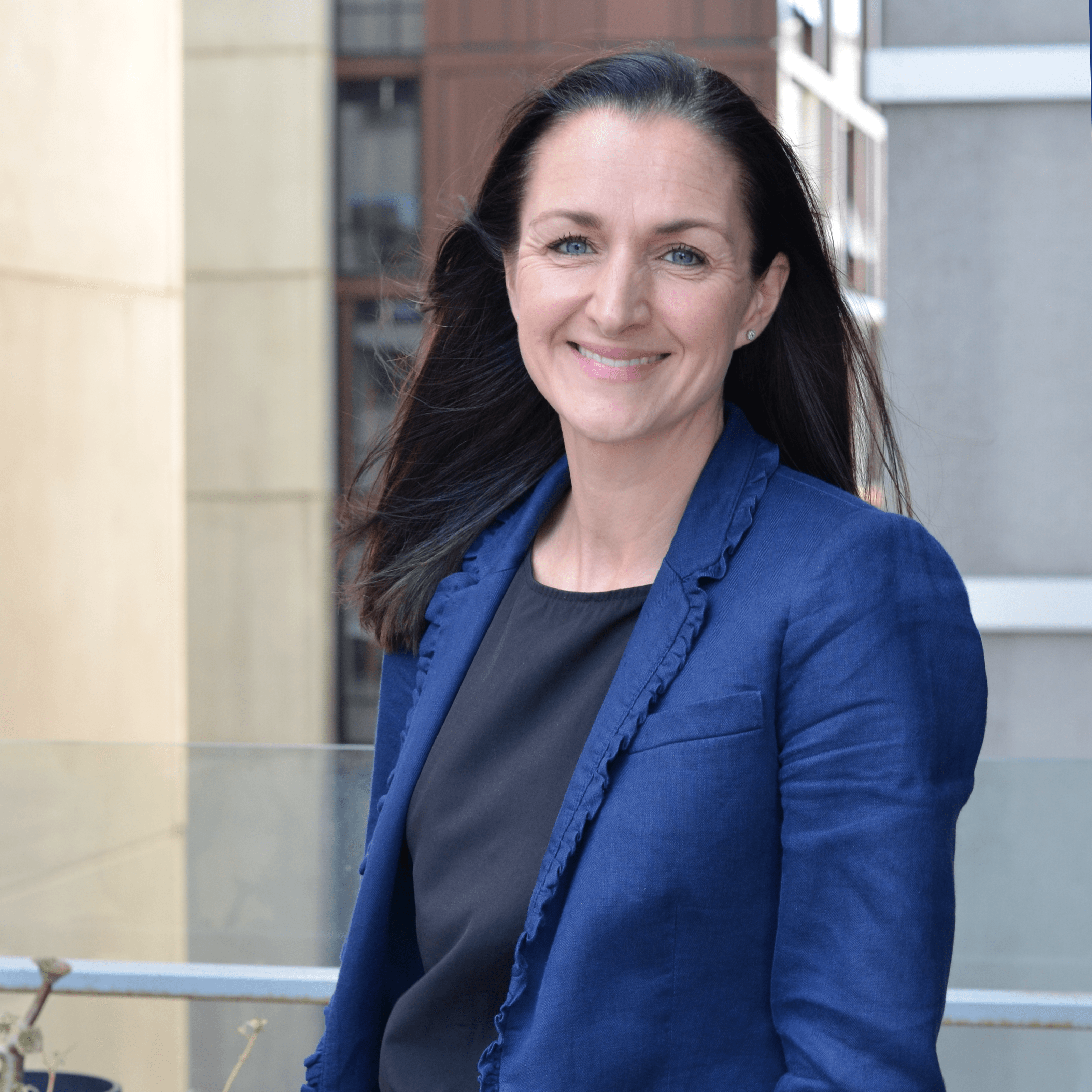 Emily Mackay Emily MacKay in a blue blazer and black top outside the faculty of education