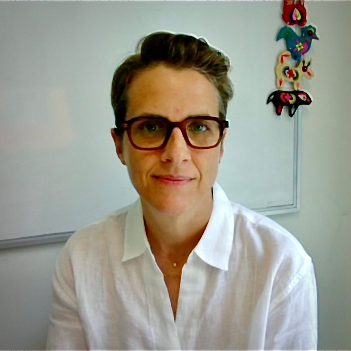 Sarah E. Truman Sarah E. Truman wears glasses and sits in a classroom